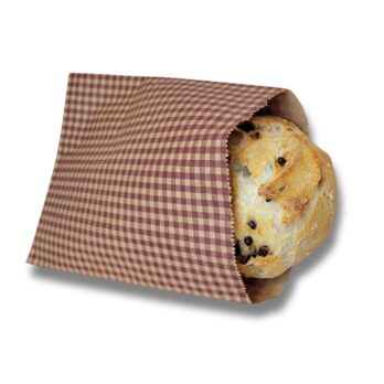 Photo of a paper bread bag with a muffin inside.