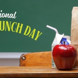 Photo of a paper lunch bag sitting on a desk.